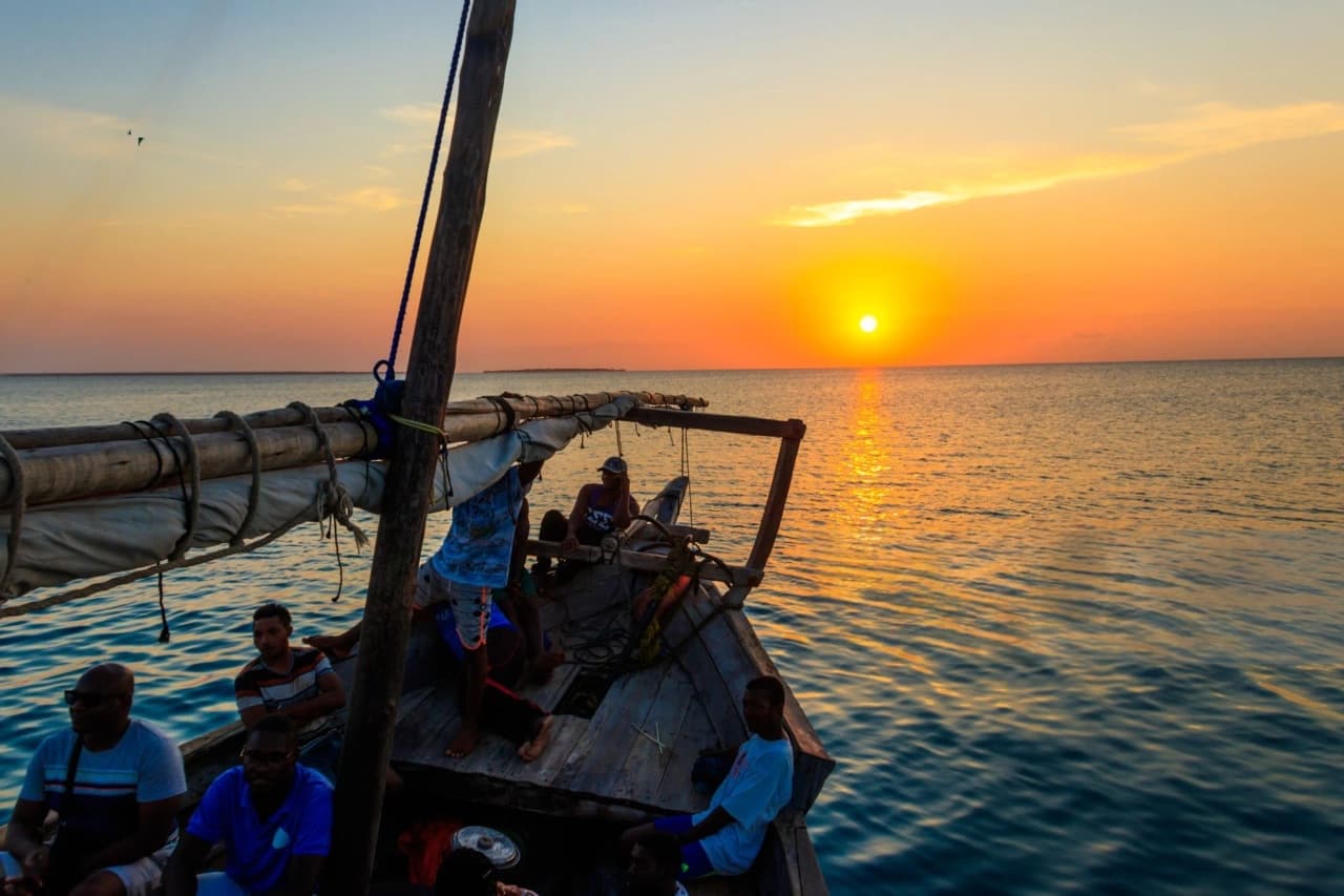 Boat cruising calmly at sunsetraying of Indian Ocean