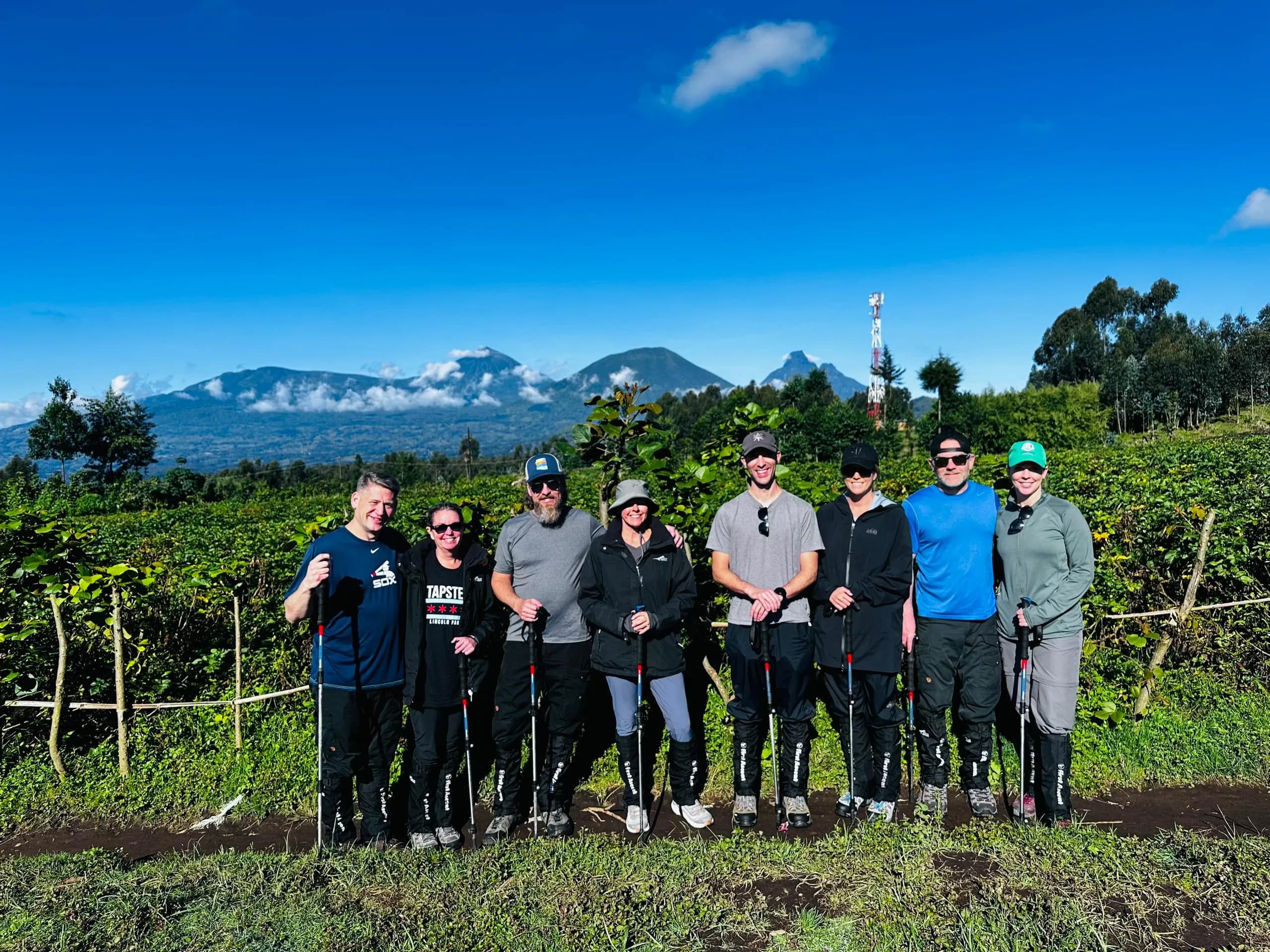 A group of travelers after mountain gorilla trekking in Volcanoes National Park