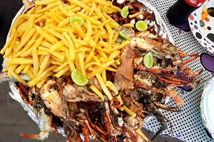 Traditional Zanzibar local food plate with fresh seafood, spiced rice, and tropical flavors – How To Visit & Experience Zanzibar: Ultimate Travel Guide.