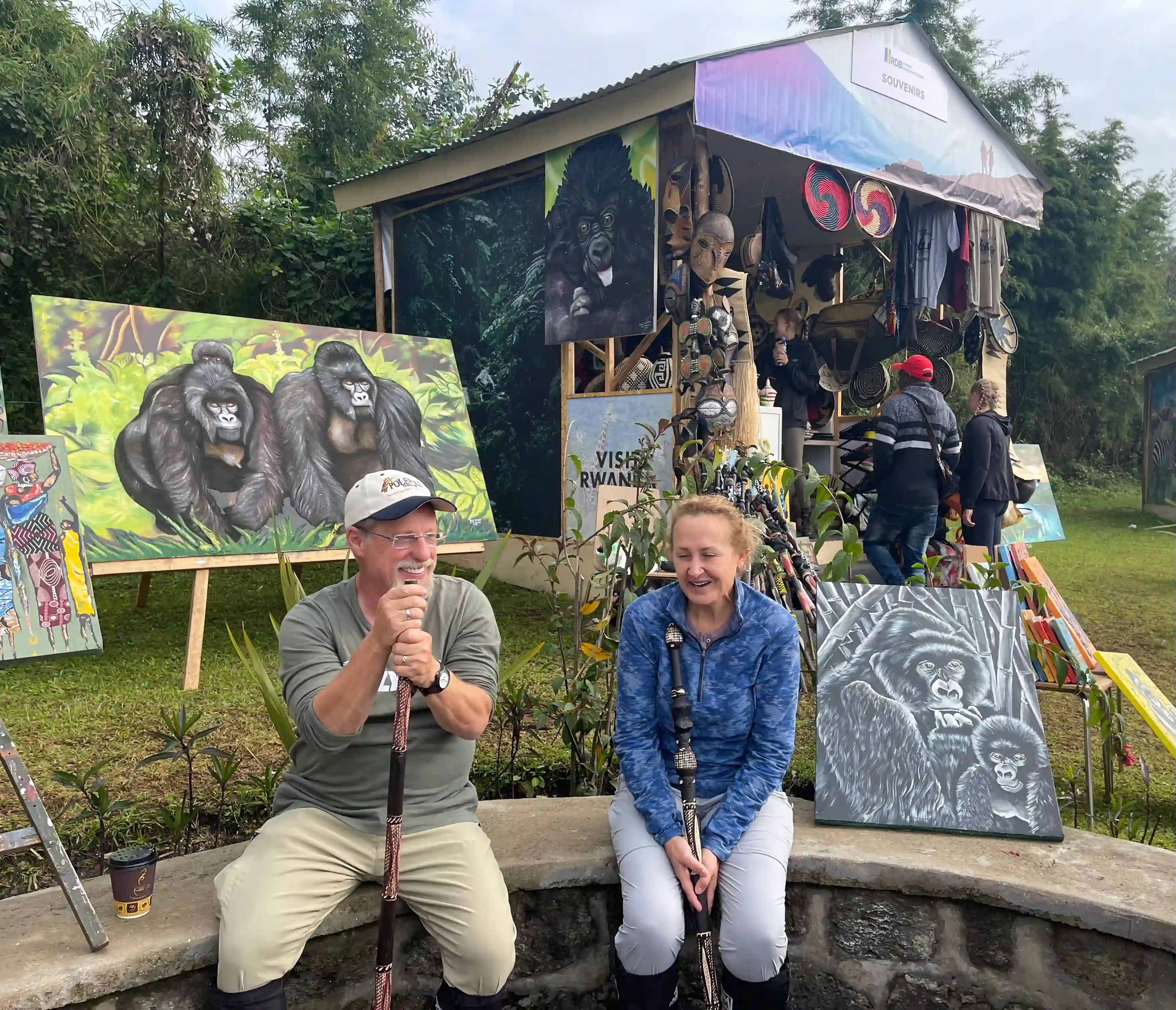 Couple exploring handmade crafts and art at a local shop near Volcanoes National Park, Rwanda