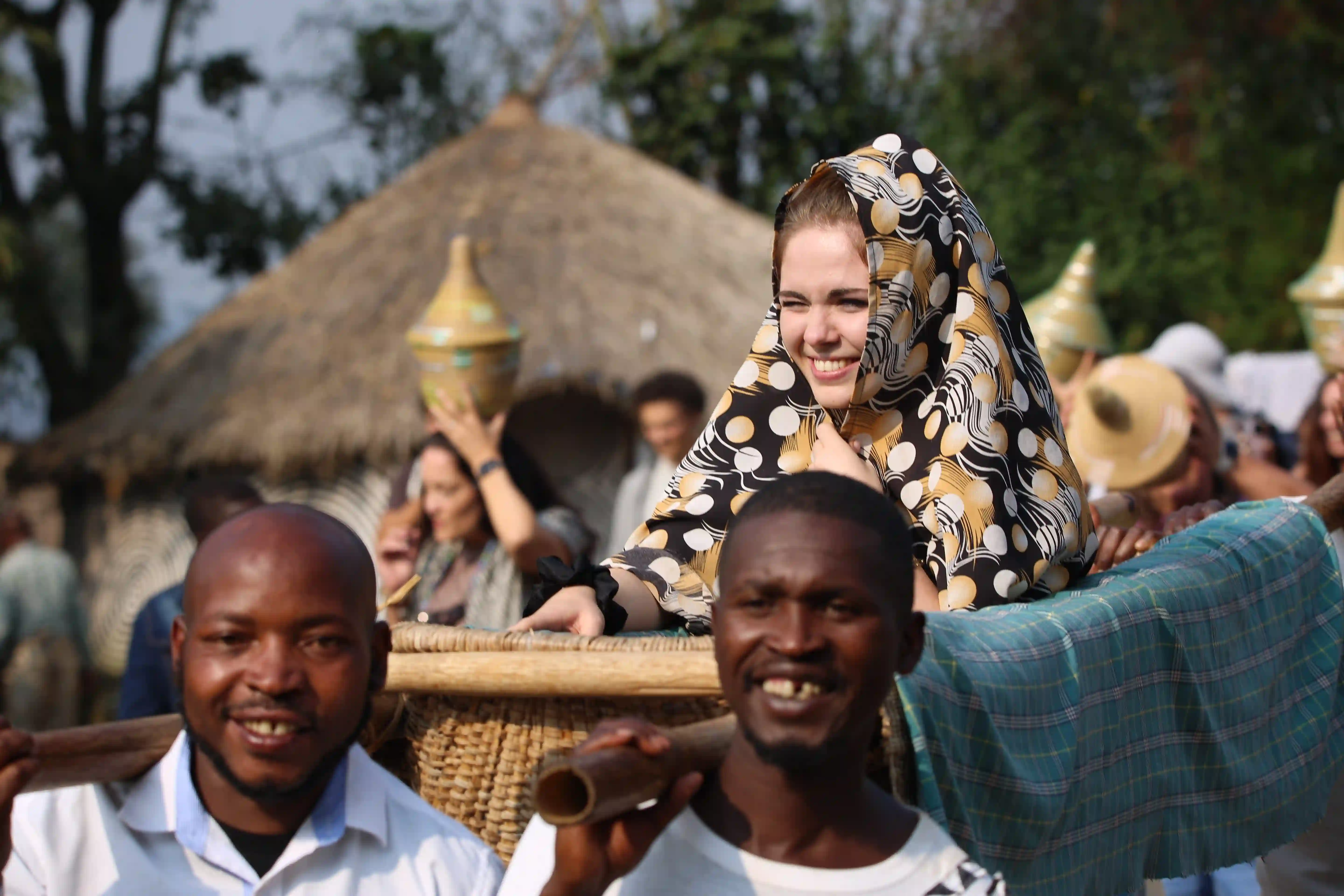 Traveler dressed as a traditional Rwandan bride experiencing authentic cultural ceremony at Gorilla Guardians Village in Musanze, Rwanda.