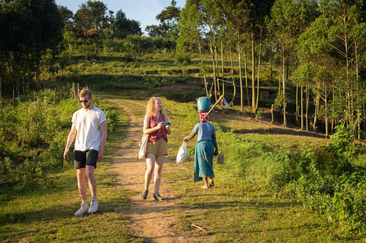 Tourists exploring lake Bunyonyi: cultural experiences, hiking, fishing experience, history, local food and island exploration, canoeing, and kayaking
