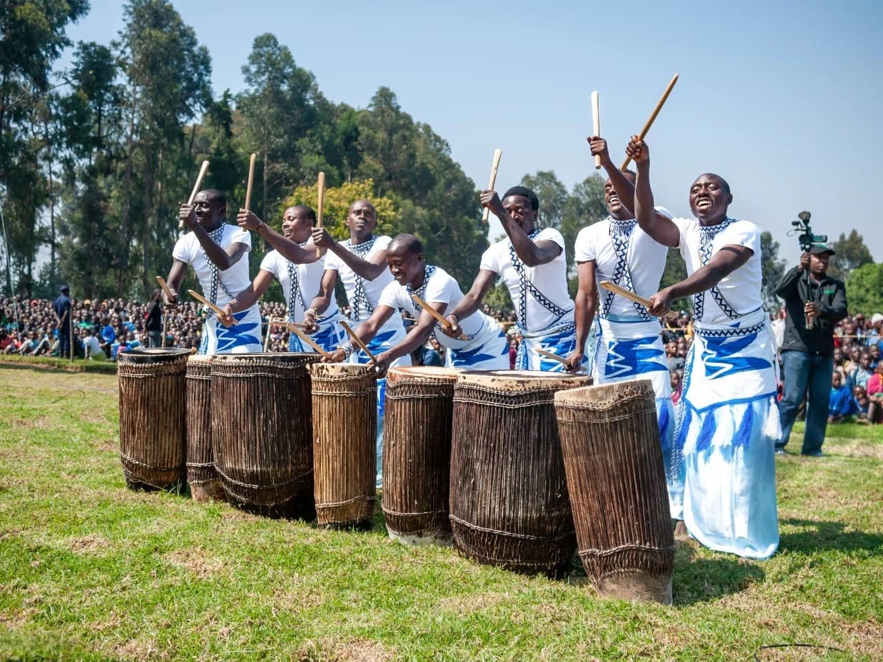 Intore dancers performing with traditional drums during a cultural ceremony in Rwanda, showcasing vibrant Rwandan culture and heritage.