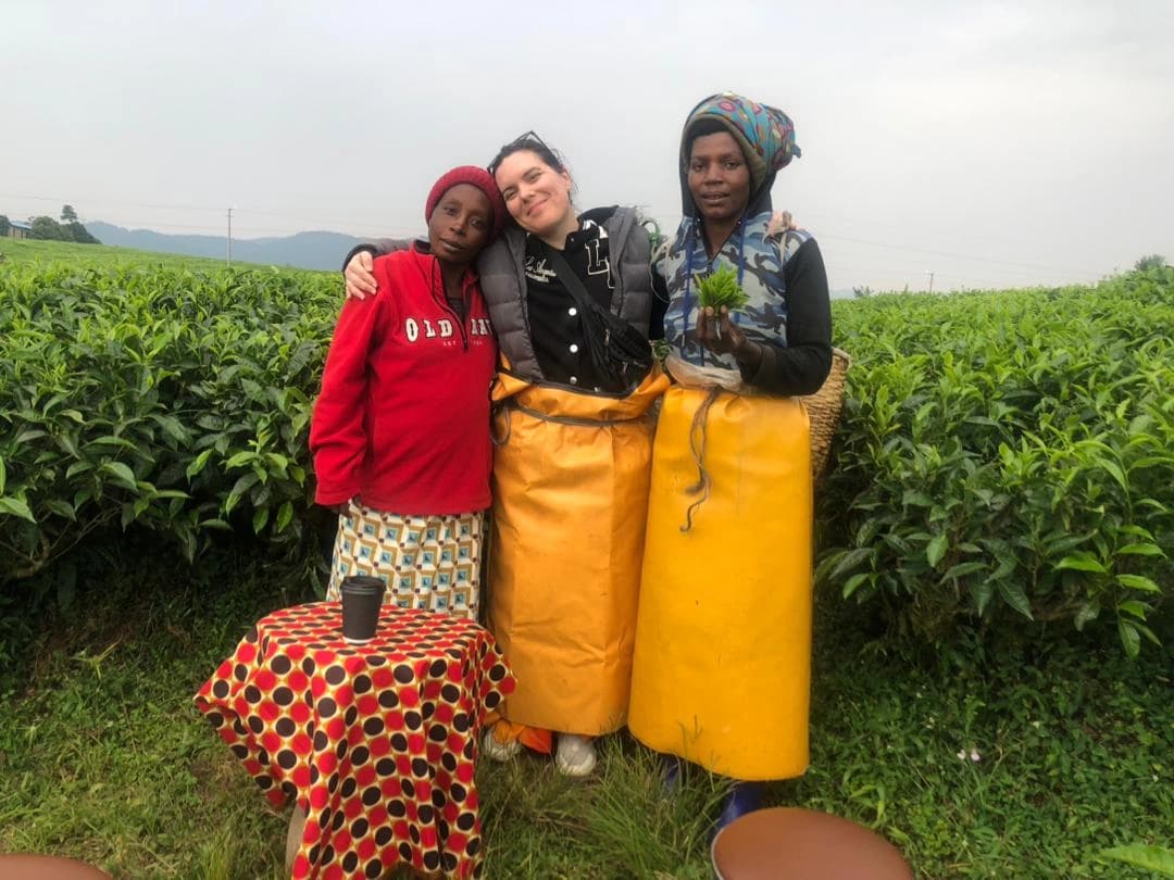 Traveler enjoying a tea plantation experience and tea tasting along Rwanda’s scenic Congo Nile Trail.