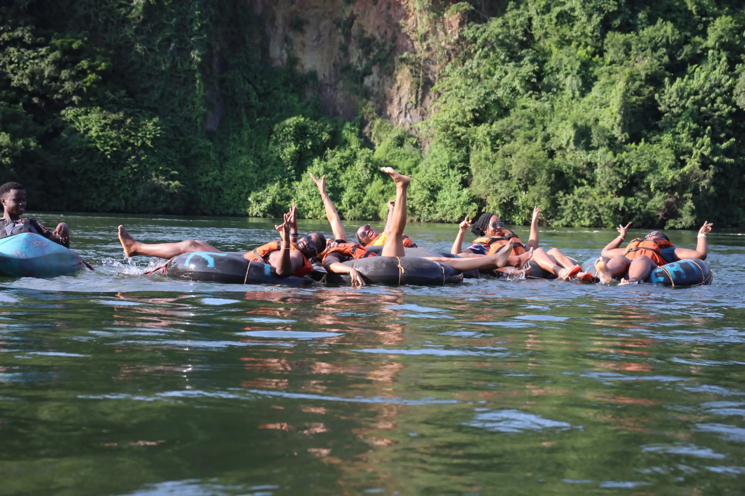 Travelers rafting on the Nile River in Jinja, Uganda, experiencing white-water adventure in East Africa.
