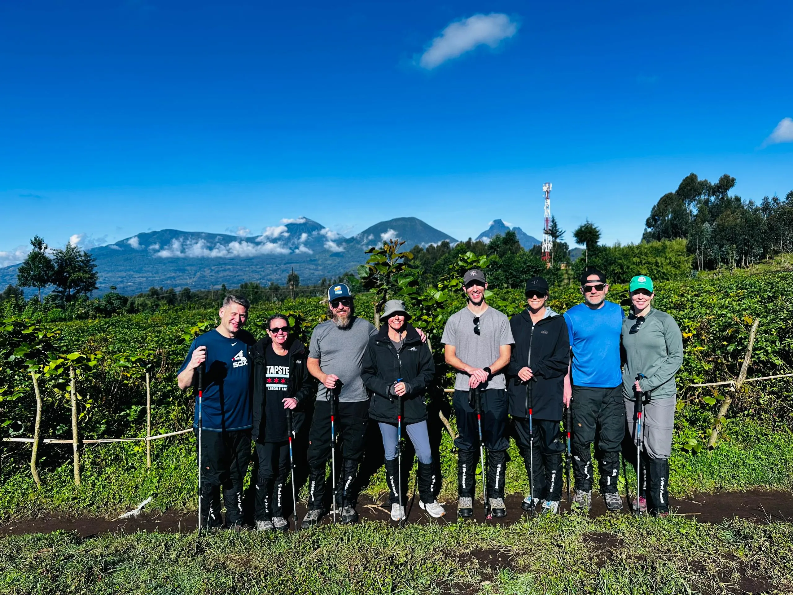 A group of travelers after mountain gorilla trekking in Volcanoes National Park