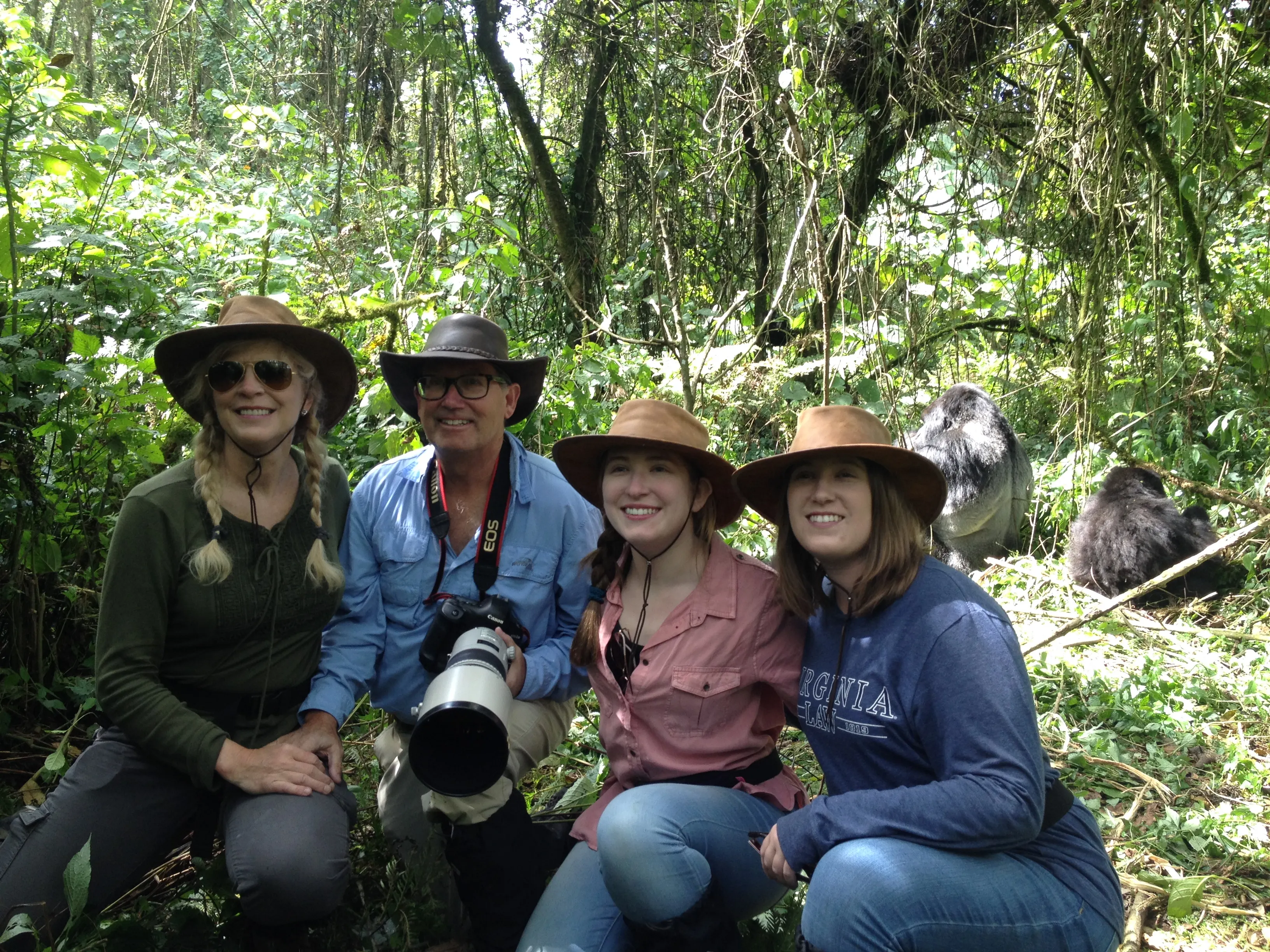 Happy family in Volcanoes national park doing mountain gorilla trekking